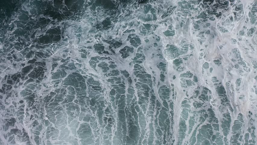 Great aerial footage in 4K from above of the Atlantic Ocean with a great view of the waves breaking and the sea water getting churned up. | Shutterstock HD Video #1099162751
