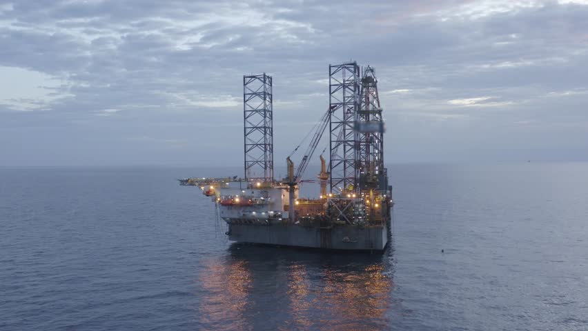 Aerial view of jack up drilling rig in the middle of the ocean while rig move at night time
 Royalty-Free Stock Footage #1099164769