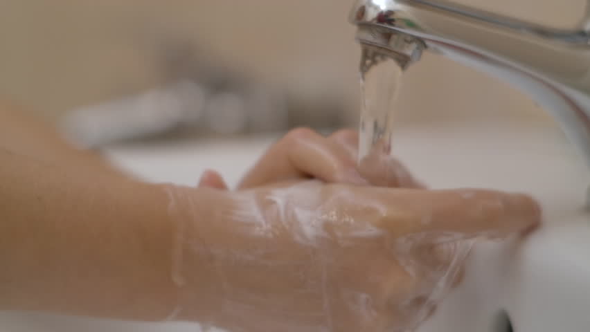 Woman Washing Hands Rubbing With Soap. Little Girl Washing Hands With Soap Over Sink in Bathroom. Child For Corona Virus Prevention, Hygiene to Stop Spreading. Slow Motion. Royalty-Free Stock Footage #1099166603