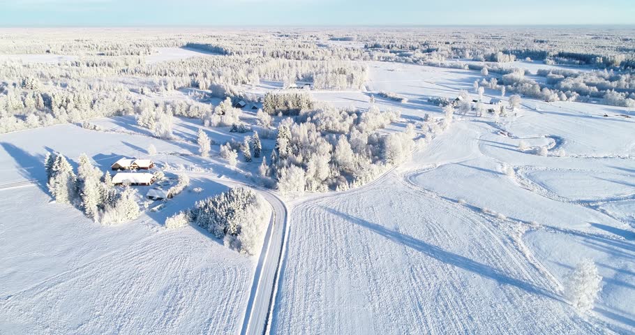 An aerial view of a frosty rural landscape on a winter day in Estonia, Northern Europe Royalty-Free Stock Footage #1099168073