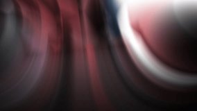 a blurry image of a red and black object with a blurry background of red and black circles