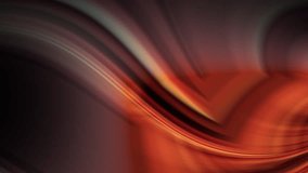 a blurry image of a red and orange swirl with a black background