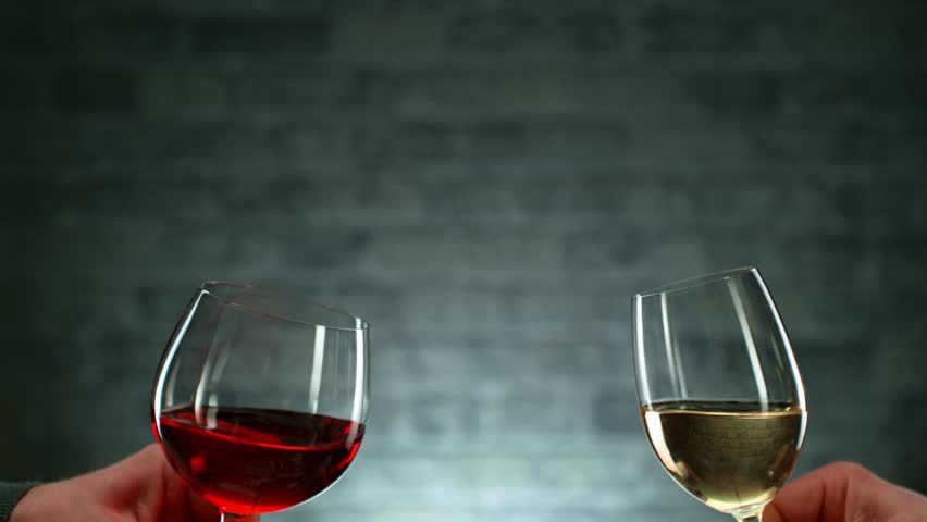Super Slow Motion Shot of Clinking Two Glasses of Red and White Wine. Filmed on high speed cinematic camera at 1000fps Royalty-Free Stock Footage #1099175949