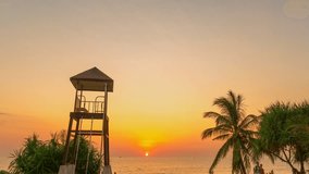 
timelapse colorful bright sky of sunset behind lifeguard tower at Karon beach.
Karon beach is broad and long Sand and beautiful beach.
4k stock footage video in travel concept. bright sky background
