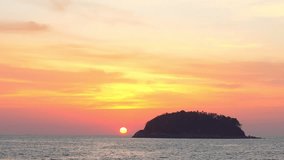 scenery yellow sun going down to the sea.
beautiful moving cloud in sweet sky at sunset in Kata beach Phuket Thailand
4k stock footage video in travel concept.