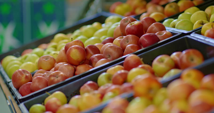 ripe apples on counter in food market, closeup view, buying organic fruits, 4K, Prores