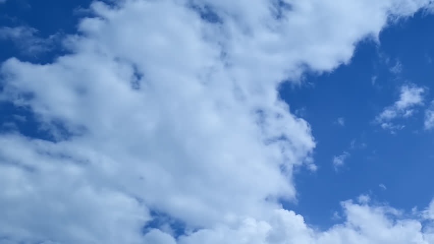 Blue sky and white time lapse sunny clouds, blue skies with natural cloudscape, fast motion mass in horizon.