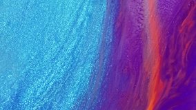 Fluid art painting video, modern acrylic texture with flowing effect. Liquid paint mixing backdrop with splash and swirl. Artistic background motion with purple, blue and orange overflowing colors.