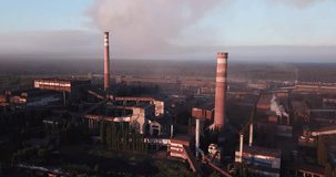 4K summer morning aerial video of smoking chimneys and panorama of metal plant