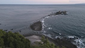 Aerial drone view of Mitsuishi sea rocks at sunset, Kanagawa Prefecture, Japan