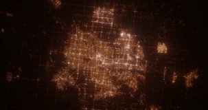 Edmonton (Canada) aerial view at night. Top view on modern city with street lights. Camera is zooming out, rotating clockwise. Vertical video. The north is on the left side