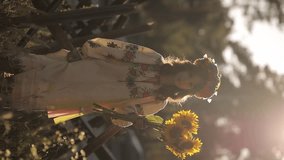 A beautiful Ukrainian girl in a Ukrainian national vyshyvanka dress with a bouquet of sunflowers against the background of anti-tank hedgehogs. war in Ukraine. War of Russia against Ukraine. - Powered by Shutterstock - Get 15% off with code: PIKWIZARD15