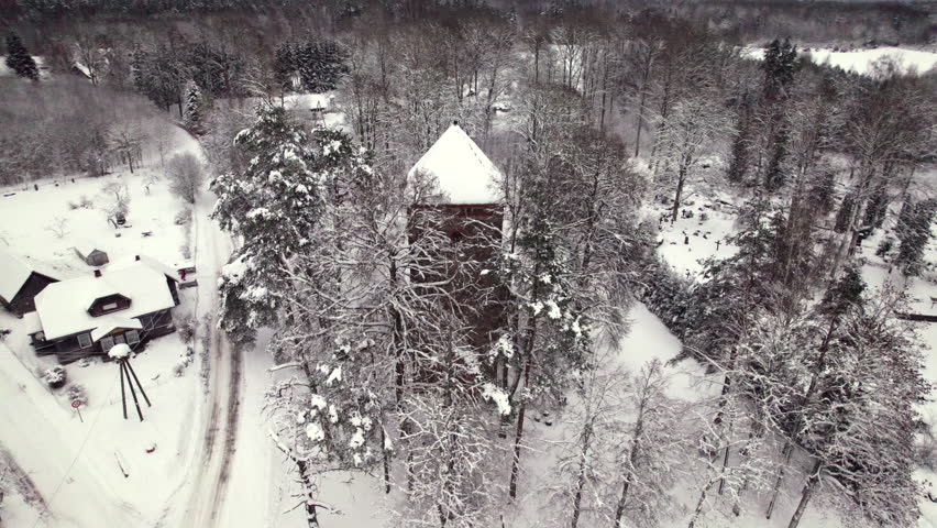 Old stone church in Latvian country side, winter time