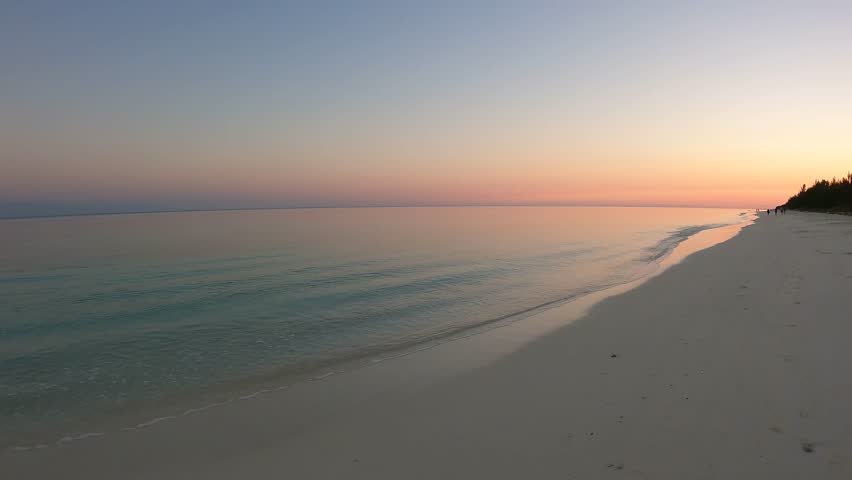 Sunset on the beach at Grand Bahama in the caribbean sea | Shutterstock HD Video #1099200135