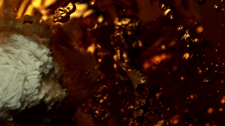 Super Slow Motion Abstract Shot of Pouring Cream into Coffee at 1000fps. Royalty-Free Stock Footage #1099203217