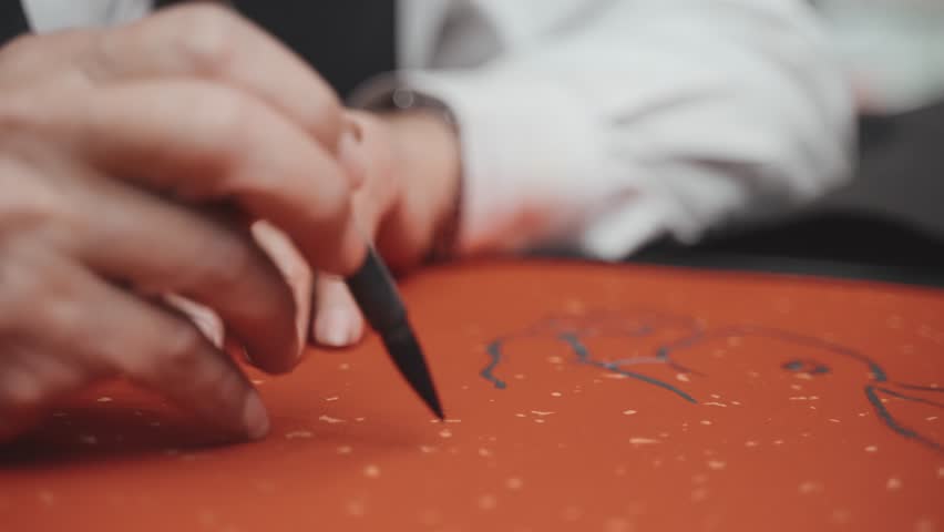 Writing chinese calligraphy with word meaning "Good Fortune" for Taditional Chinese new year