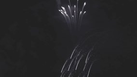 Colorful fireworks festival. Beautiful sparkling fireworks close-up view in slow motion. Wonderful real fireworks in the night sky. 4K 120fps video, ProRes 422, 10 bit ungraded C-LOG