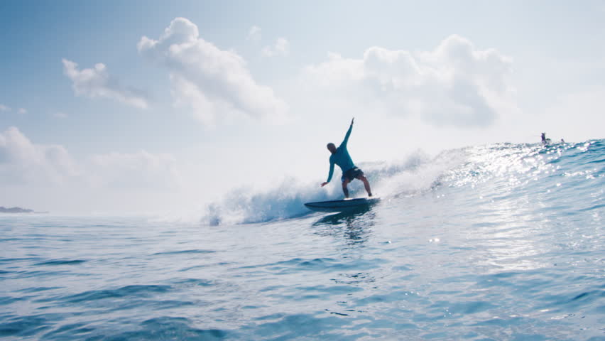 Surfer rides the ocean wave in the Maldives and falls. Beginner surfer trains his skills on the spot | Shutterstock HD Video #1099207717