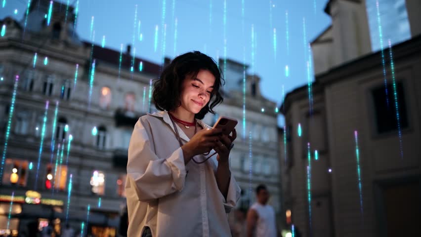 Beautiful Smiling Woman Using Smartphone on a City Street at Night. Visualization of the Internet by information lines flying to the global digital network. Wireless communication network concept Royalty-Free Stock Footage #1099207807
