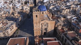 Costa Blanca's Touristic Destination: Aerial Drone Footage of the Basilica Santa Maria in Elche, Spain. Orbit shot from the distance