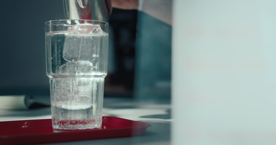 Preparation process of refreshing espresso tonic being made by professional barista. New style coffee drinks in specialty coffee place.