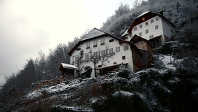 Clip filmed in Europe in Austria from a town called Hallstatt that's by a lake. Filmed in winter time in December with everything covered in snow and foggy weather. Filmed in 4k with a smooth movement