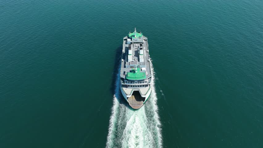 Drone shot of a ferry boat using sensors to self drive itself. Royalty-Free Stock Footage #1099229045