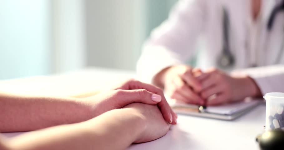 Doctor hand calms patient in clinic closeup Royalty-Free Stock Footage #1099233109