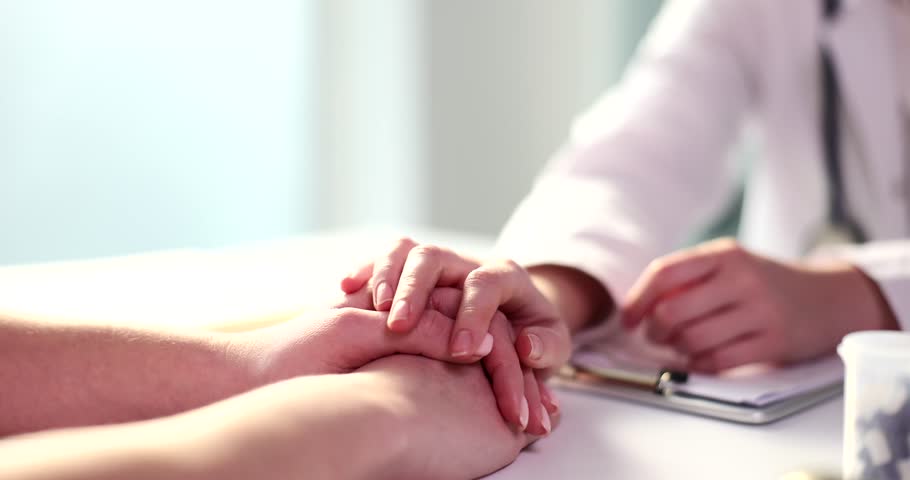 Doctor hand calms patient in clinic closeup | Shutterstock HD Video #1099233109