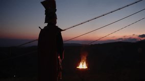 Silhouette of a Roman soldier at sunset on a mountain - Powered by Shutterstock - Get 15% off with code: PIKWIZARD15