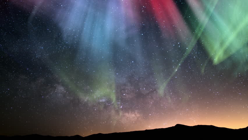 Aurora Green Purple Red and Milky Way Galaxy Over Horizon Loop | Shutterstock HD Video #1099234313