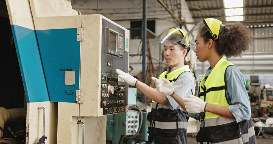 Machine technicians in a factory are checking electrical equipment and machines to be ready for use. working professionally. Concept Blue collar