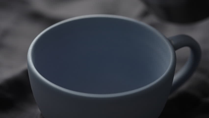 Slow motion pour hot chocolate into blue cup closeup | Shutterstock HD Video #1099235971