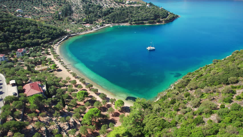 Beautiful Paralia Dexia bay with turquoise sea water on Ithaca island, Kefalonia, Ionian sea, Greece. Aerial view, orbit shot. Ithaki island landscape