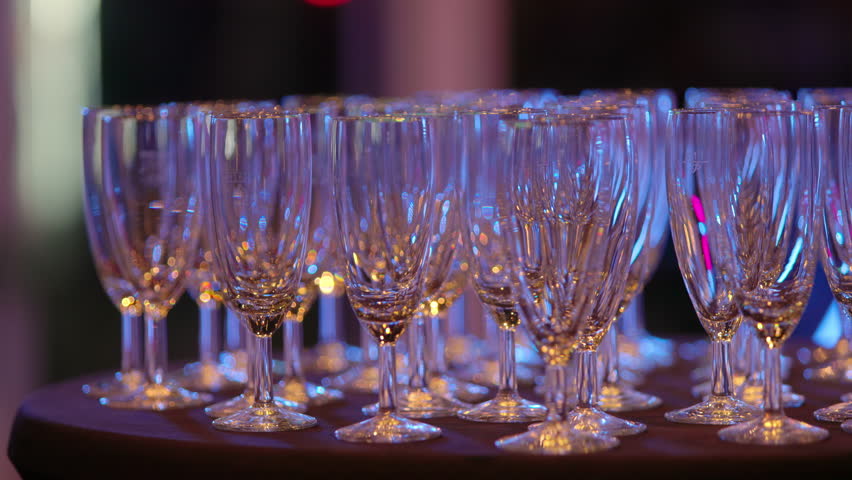 Filling up glasses of champagne on an exclusive event - close up view - Powered by Shutterstock - Get 15% off with code: PIKWIZARD15