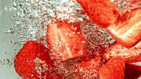 Strawberries fall into a whirlpool. Filmed is slow motion 1000 fps. High quality FullHD footage - Powered by Shutterstock - Get 15% off with code: PIKWIZARD15