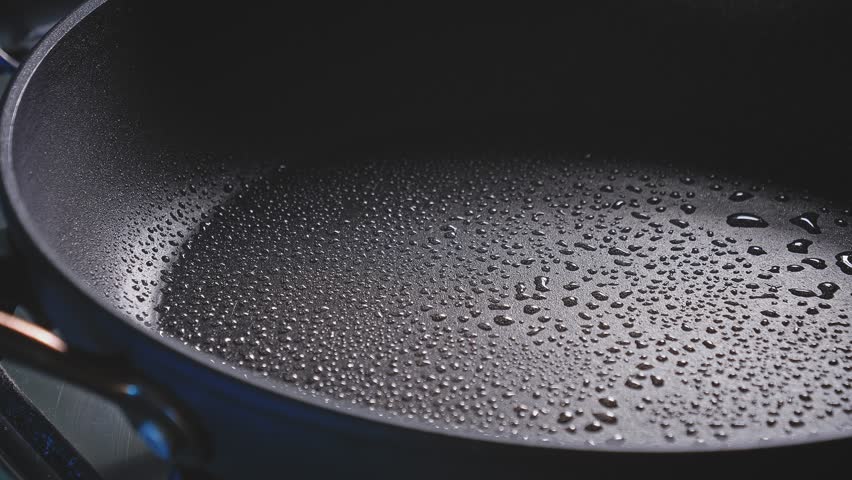 Breast Chicken Meat Cut In Cubes And Bread With Flour Stir Fry On A Pan. Close up