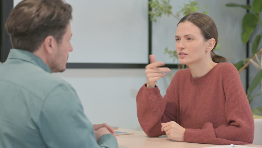 Talking Young People Discussing Work in Office | Shutterstock HD Video #1099246659