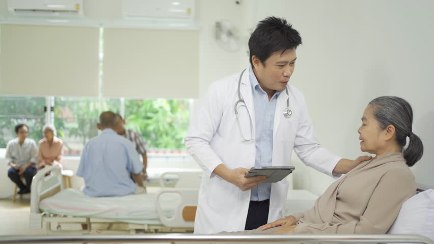 Portrait of Asian doctor check up body of sick old senior elderly patient on bed in hospital in medical and healthcare treatment at nursing home. People lifestyle | Shutterstock HD Video #1099250199