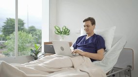 Portrait of happy caucasian sick patient using a computer notebook laptop device to work on business on bed in hospital in medical and healthcare treatment at nursing home or clinic. People lifestyle - Powered by Shutterstock - Get 15% off with code: PIKWIZARD15