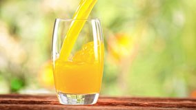 Super Slow Motion Shot of Pouring Fresh Orange Juice into Glass at 1000 fps. - Powered by Shutterstock - Get 15% off with code: PIKWIZARD15