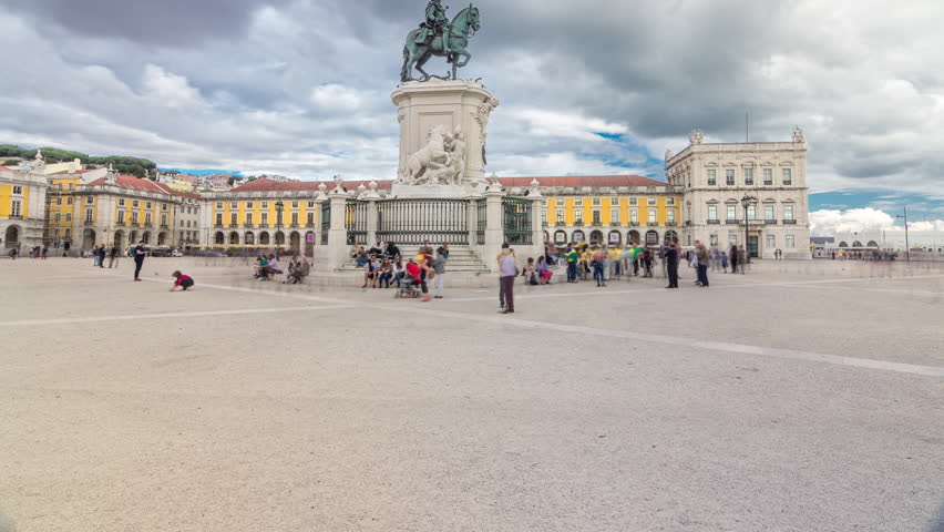 Bronze statue of King Jose I and triumphal arch at Rua Augusta at Commerce square timelapse hyperlapse in Lisbon, Portugal. Cloudy sky. Walking area Royalty-Free Stock Footage #1099255307