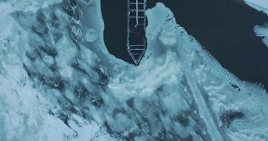 Railroad Bridge On Frozen St. Croix River In Hudson WI - Top Down Aerial View