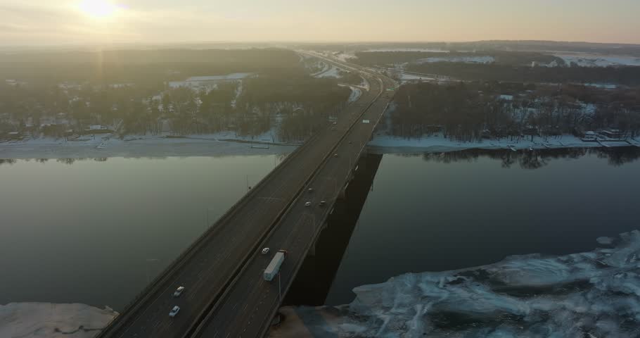 Descending Aerial Orbit Of 94 Bridge Over Icy St Croix River Hudson WI At Sunset