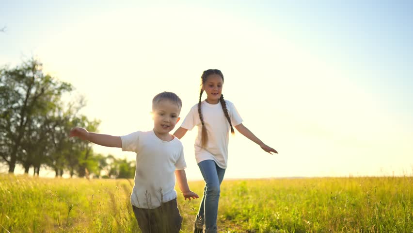 Happy family kids. people in the park children child running together in the park at sunset silhouette. mom dad daughter and son are run happy family and little child fun in summer. dream kids run | Shutterstock HD Video #1099269107