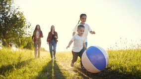 kid play football in the park. group of children in nature playing ball park silhouette. happy family childhood dream concept. funny kids playing sunlight ball on grass under summer - Powered by Shutterstock - Get 15% off with code: PIKWIZARD15