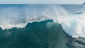 Aerial shot of breaking surf with foam in Pacific Ocean. Drone Slow motion barreling wave with texture and wind spray. Powerful stormy sea wave - Powered by Shutterstock - Get 15% off with code: PIKWIZARD15