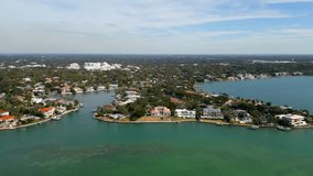 Aerial tour luxury waterfront mansion homes in Sarasota FL USA