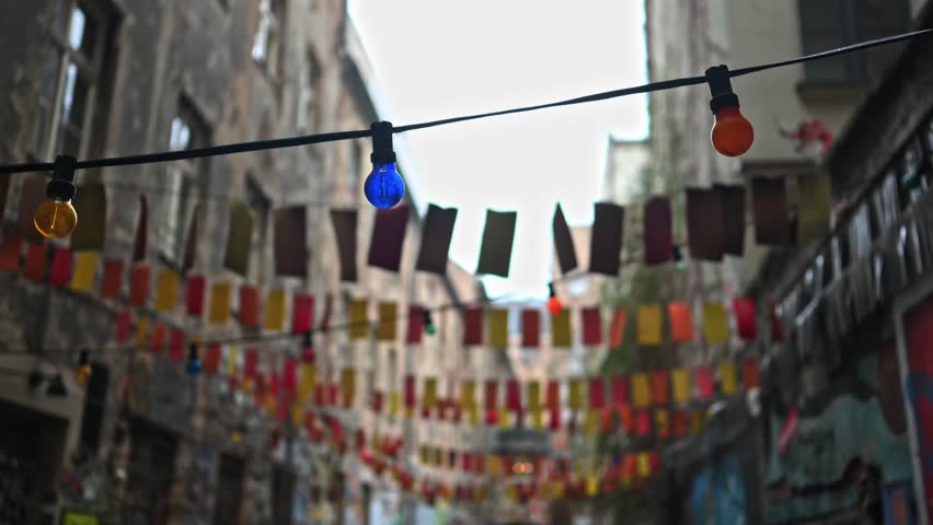 Berlin cozy art street decorated paper garlands and colorful light colorful bulbs | Shutterstock HD Video #1099276689