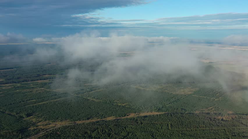 Aerial view of clouds over summer forest, 4k